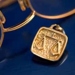 Glasses and scales of justice pendant